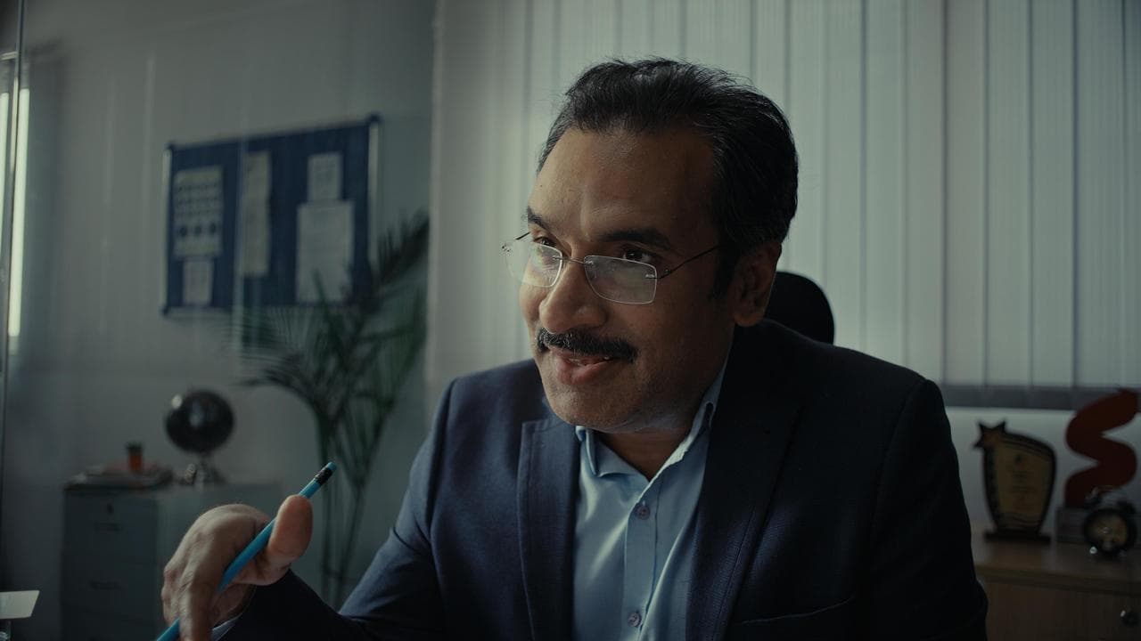 Executive being interviewed on camera in an office