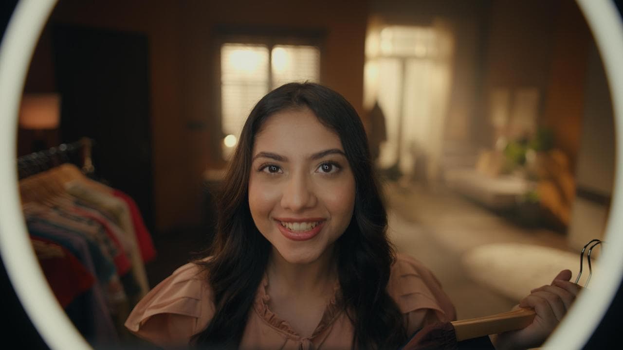 Creator shooting product content in a ring light